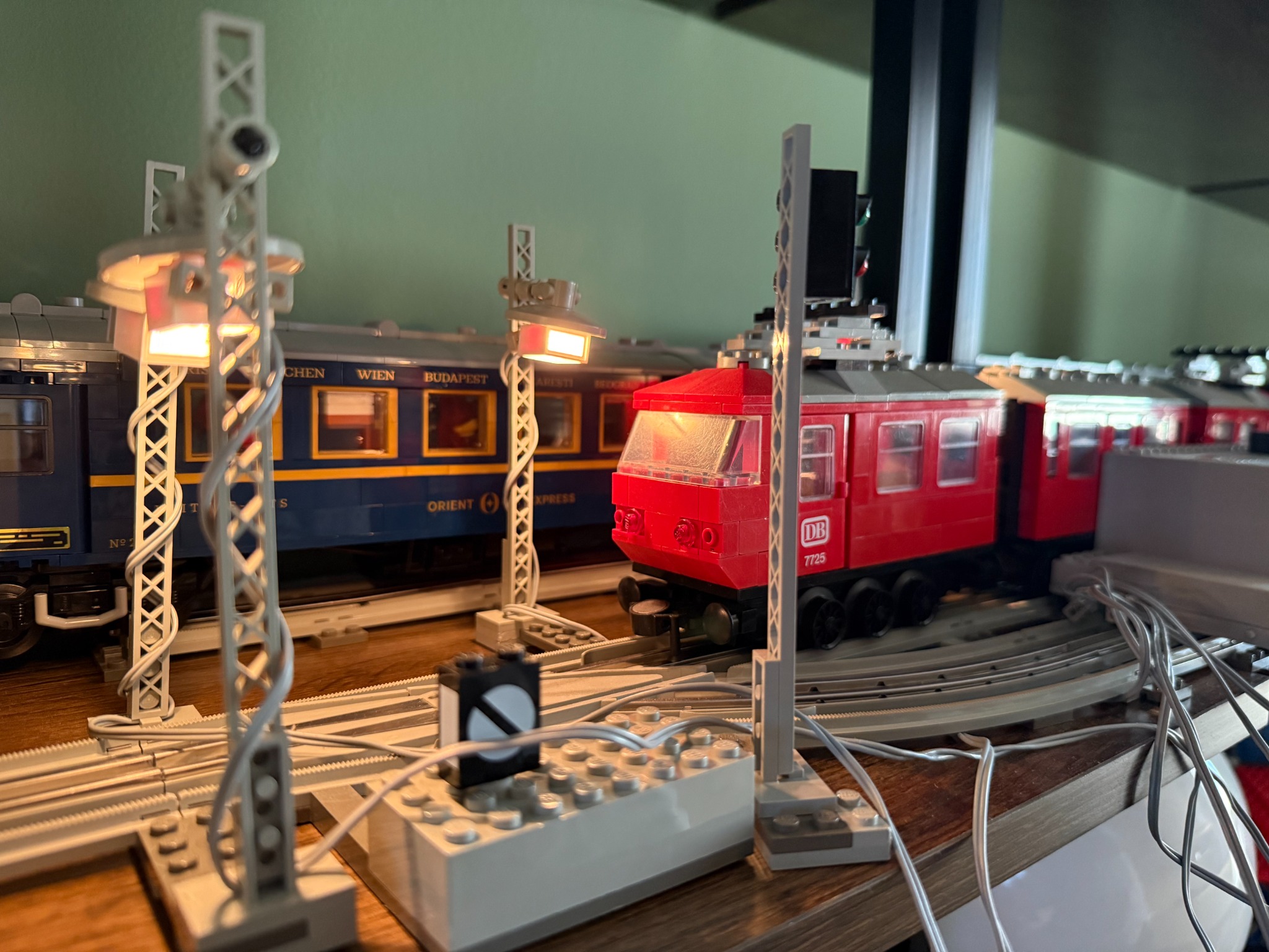 Illuminated LEGO 12V railway layout with a red locomotive and the Orient Express